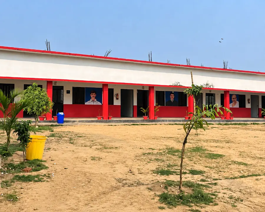 The school building seen across the open ground